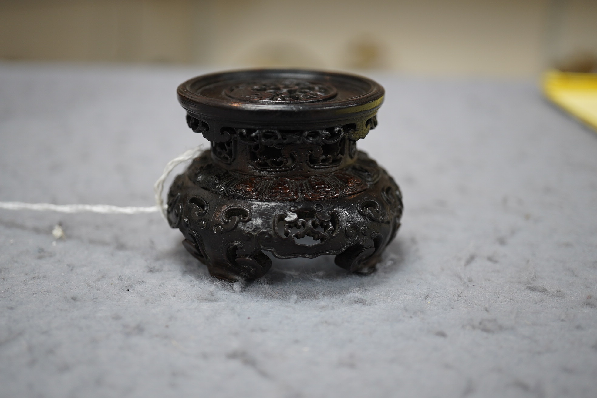 A Chinese huanghuali scholar’s stand, 18th/19th century, and a small reticulated zitan stand, 19th century